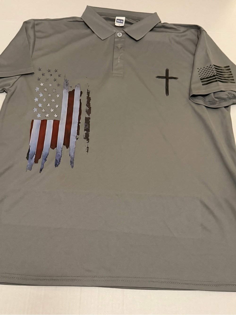 I39 Med Gray Polo w/ rugged flag and cross on front/flag on sleeve